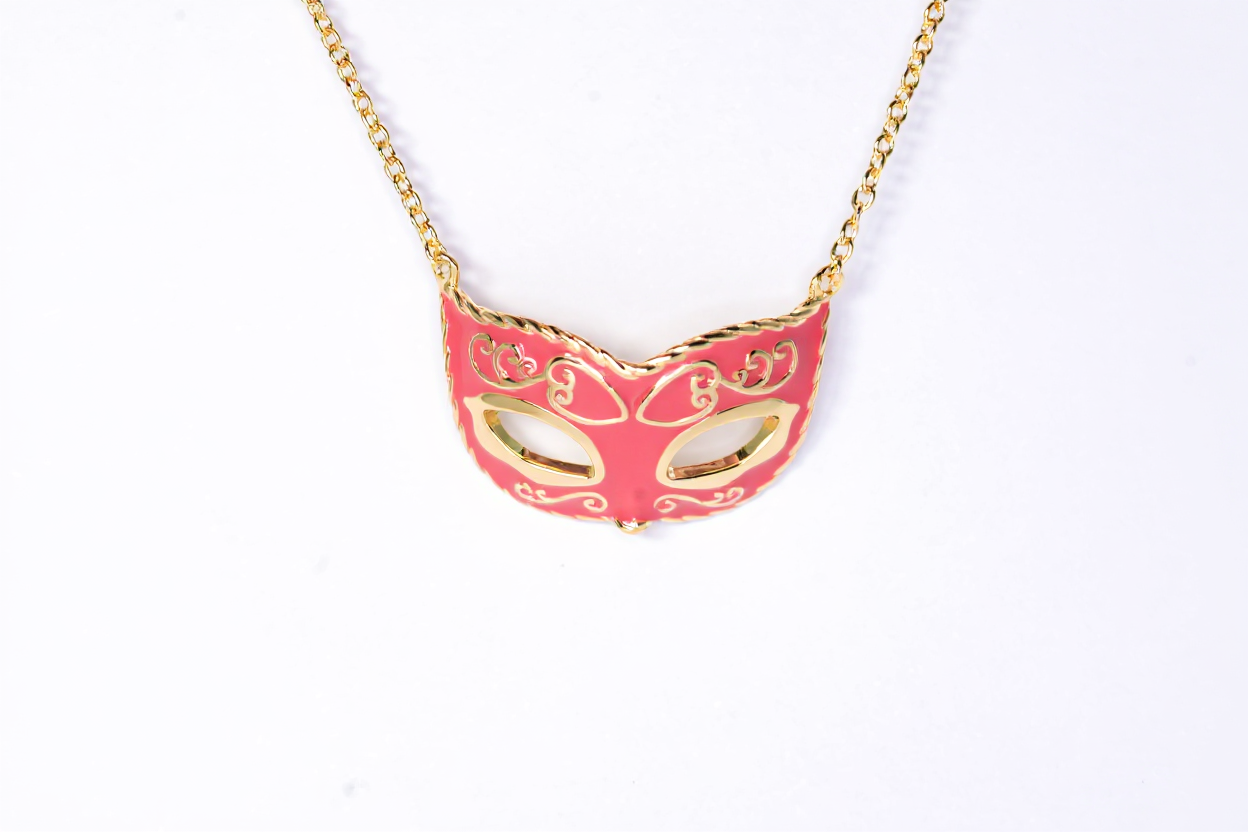 Gold-plated mask pendant necklace made of sterling silver with colorful enamel"
"Close-up of enamel mask-shaped silver necklace for women"
"Unique handcrafted artistic mask necklace on model"