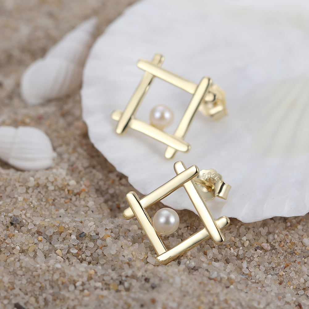 “Gold plated square pearl stud earrings”
“Square shape pearl earrings in silver with gold finish”
“Elegant pearl stud earrings for women”
“Minimalist gold stud earrings with pearl”
“Sterling silver pearl earrings with square design”