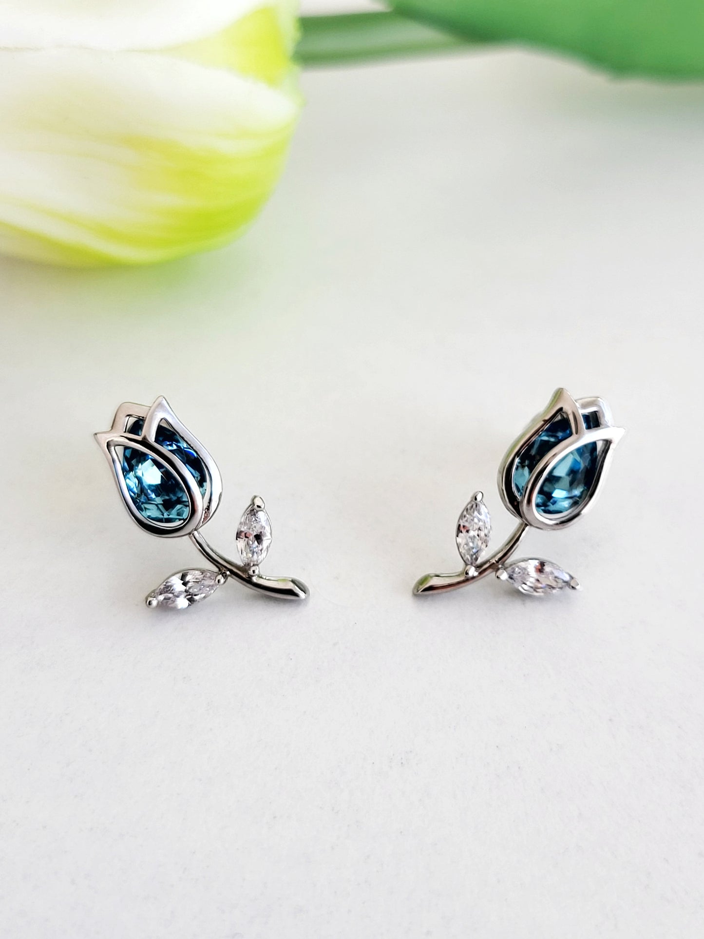 Silver Tulip and blue stone stud earrings