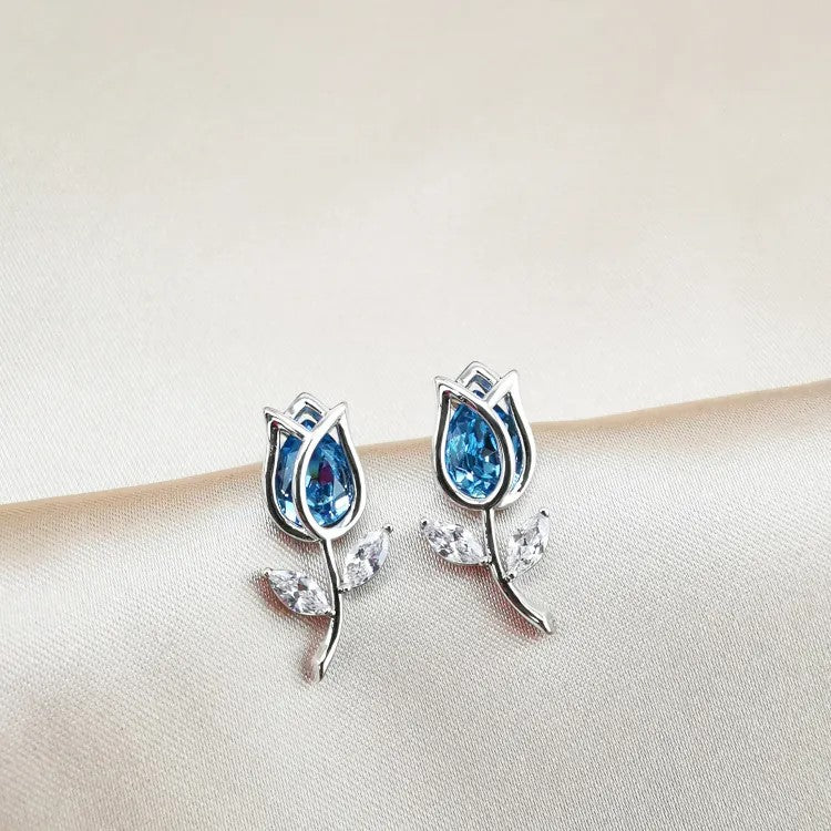 Silver Tulip and blue stone stud earrings