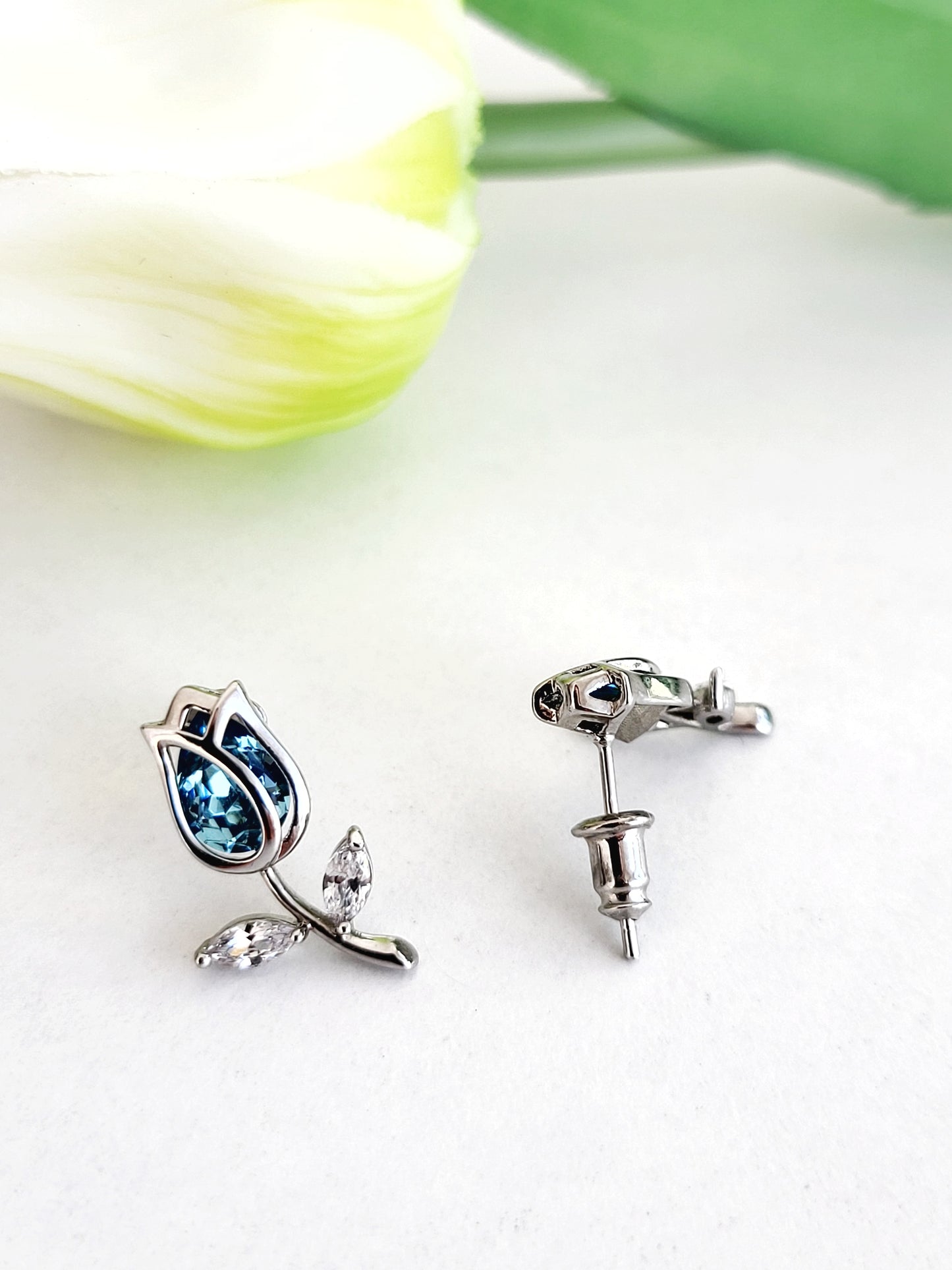 Silver Tulip and blue stone stud earrings