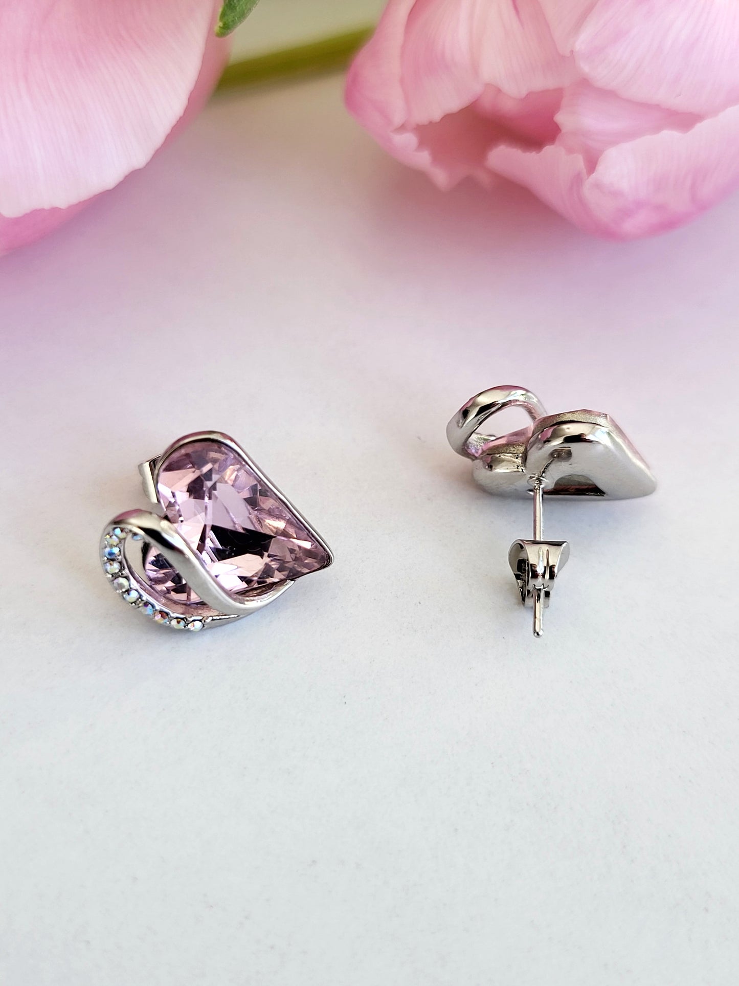 Radiant Romance: Silver Earrings with Pink Heart Shapes