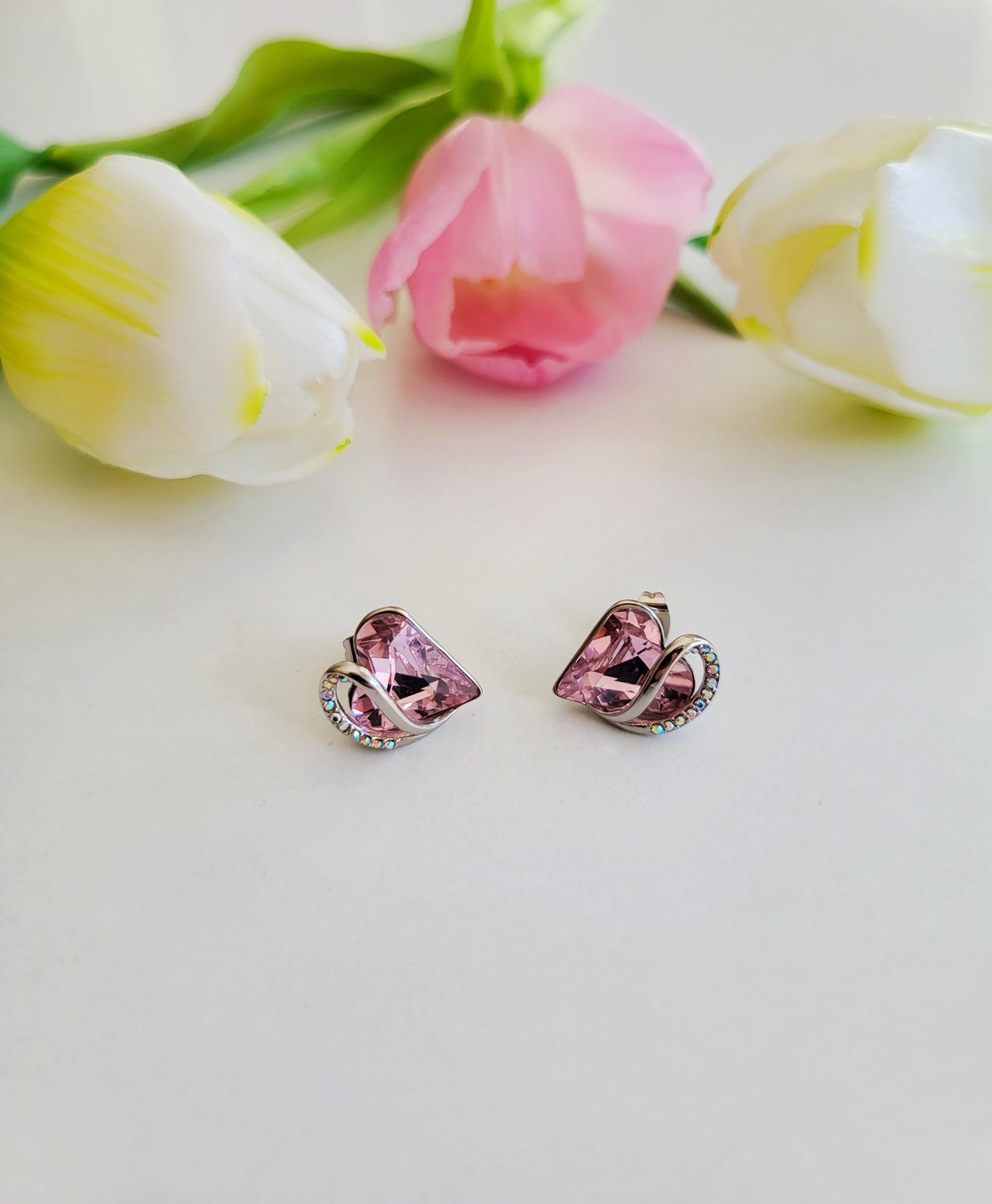 Radiant Romance: Silver Earrings with Pink Heart Shapes