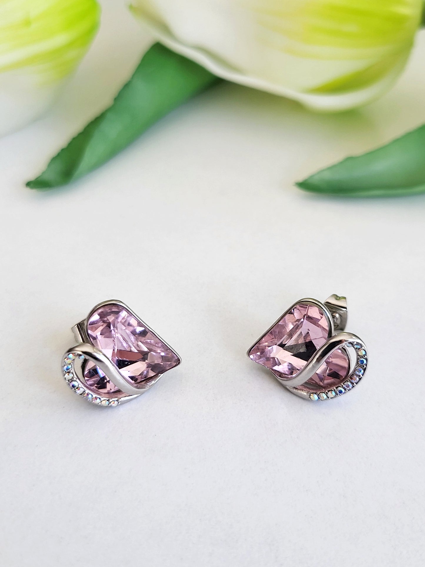 Radiant Romance: Silver Earrings with Pink Heart Shapes