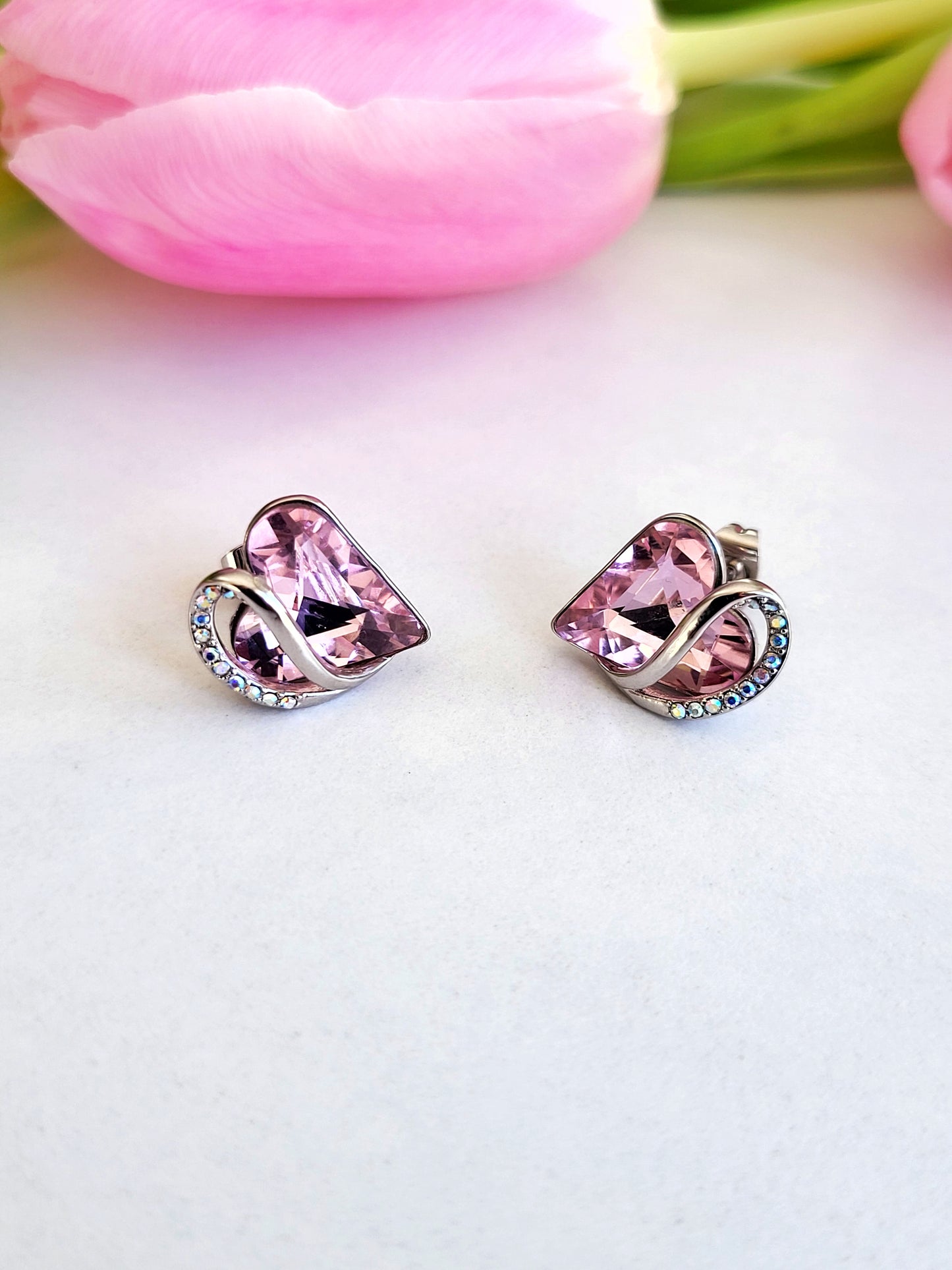 Radiant Romance: Silver Earrings with Pink Heart Shapes